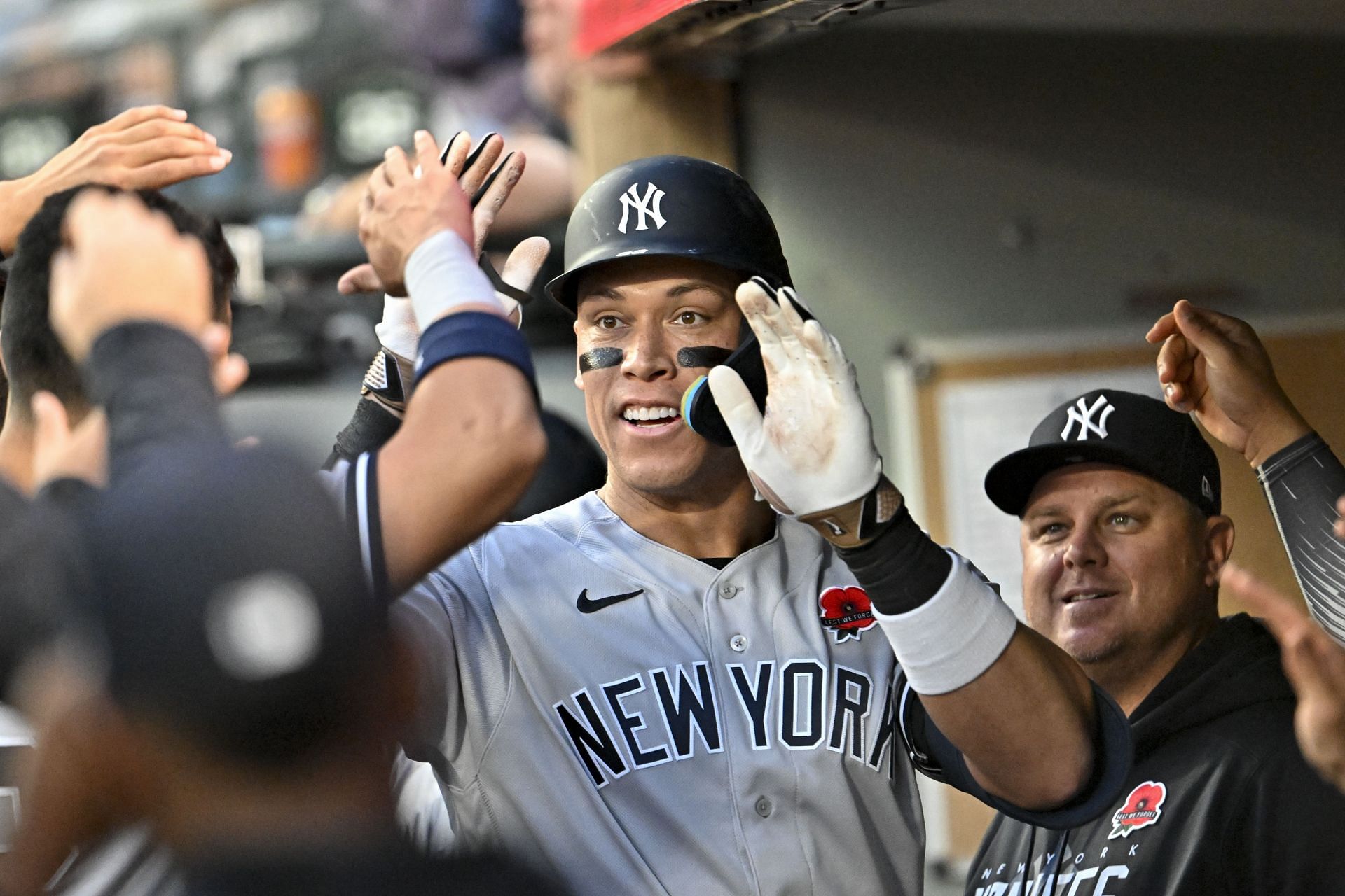 Aaron Judge of the New York Yankees celebrates with teammates after hitting a home run against the Seattle Mariners at T-Mobile Park