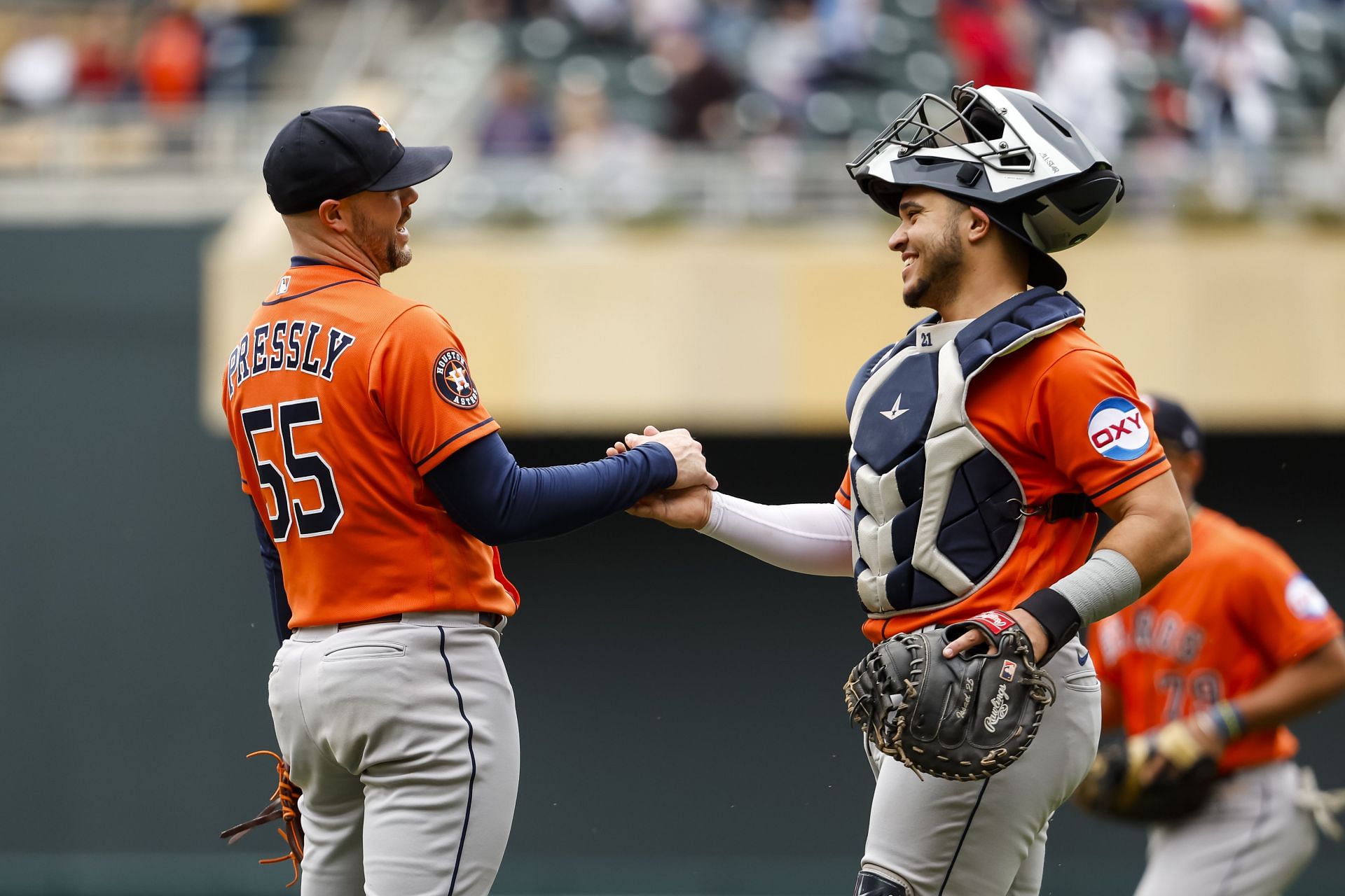 Houston Astros' Ryan Pressly (55) and Yainer Diaz celebrate after