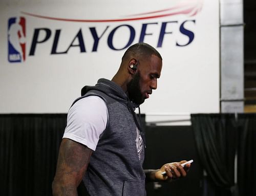 LeBron James using his smartphone