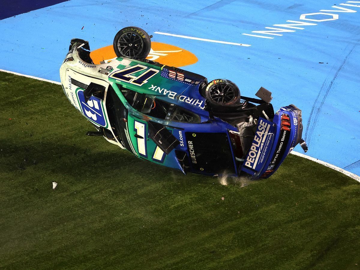 Chris Buescher, driver of the #17 Fifth Third Bank Ford, flips into the infield grass after an on-track incident during the NASCAR Cup Series Coca-Cola 600 at Charlotte Motor Speedway on May 29, 2022 in Concord, North Carolina. (Photo by James Gilbert/Getty Images)