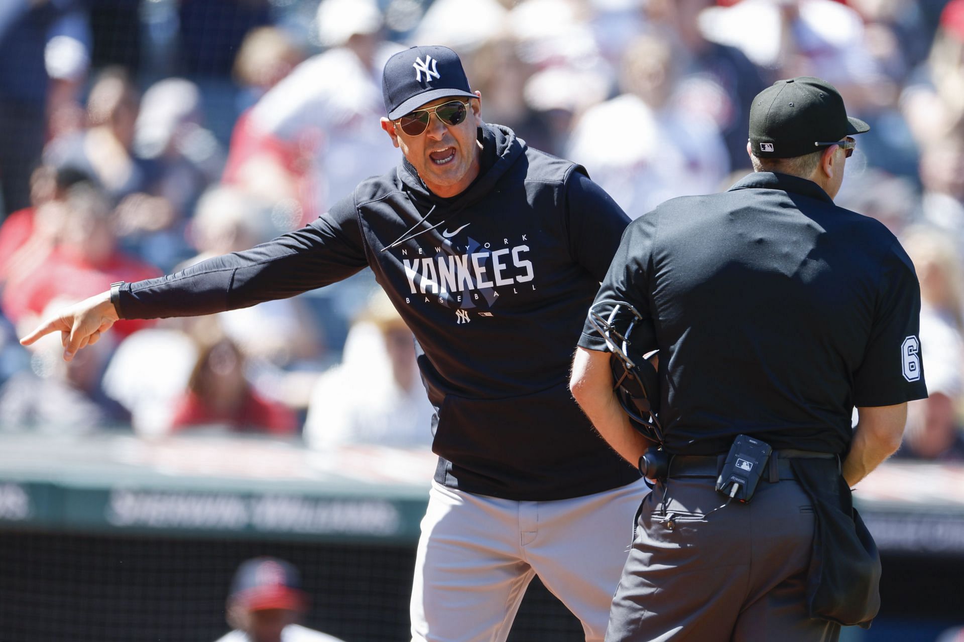 Aaron Boone argues a review call with home plate umpire Chris Guccione after being ejected at Progressive Field.