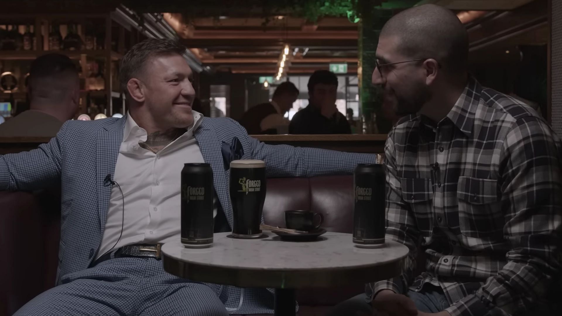 Conor McGregor (left), during interview with Ariel Helwani (right)