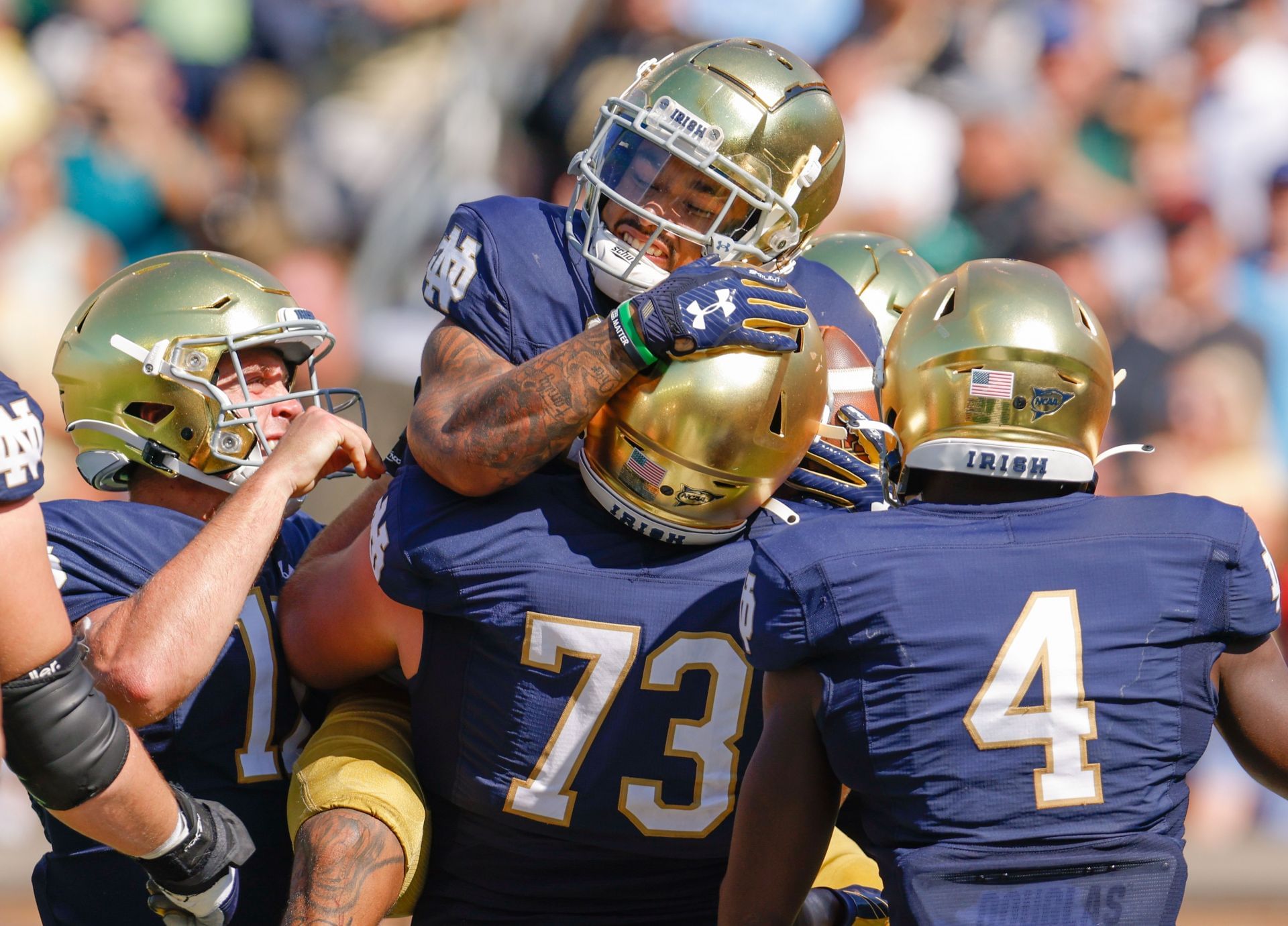 Fighting Irish players celebrate a touchdown.