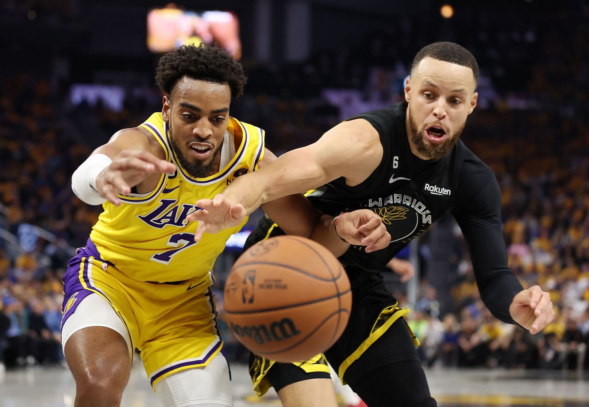 Stephen Curry chasing after a loose ball