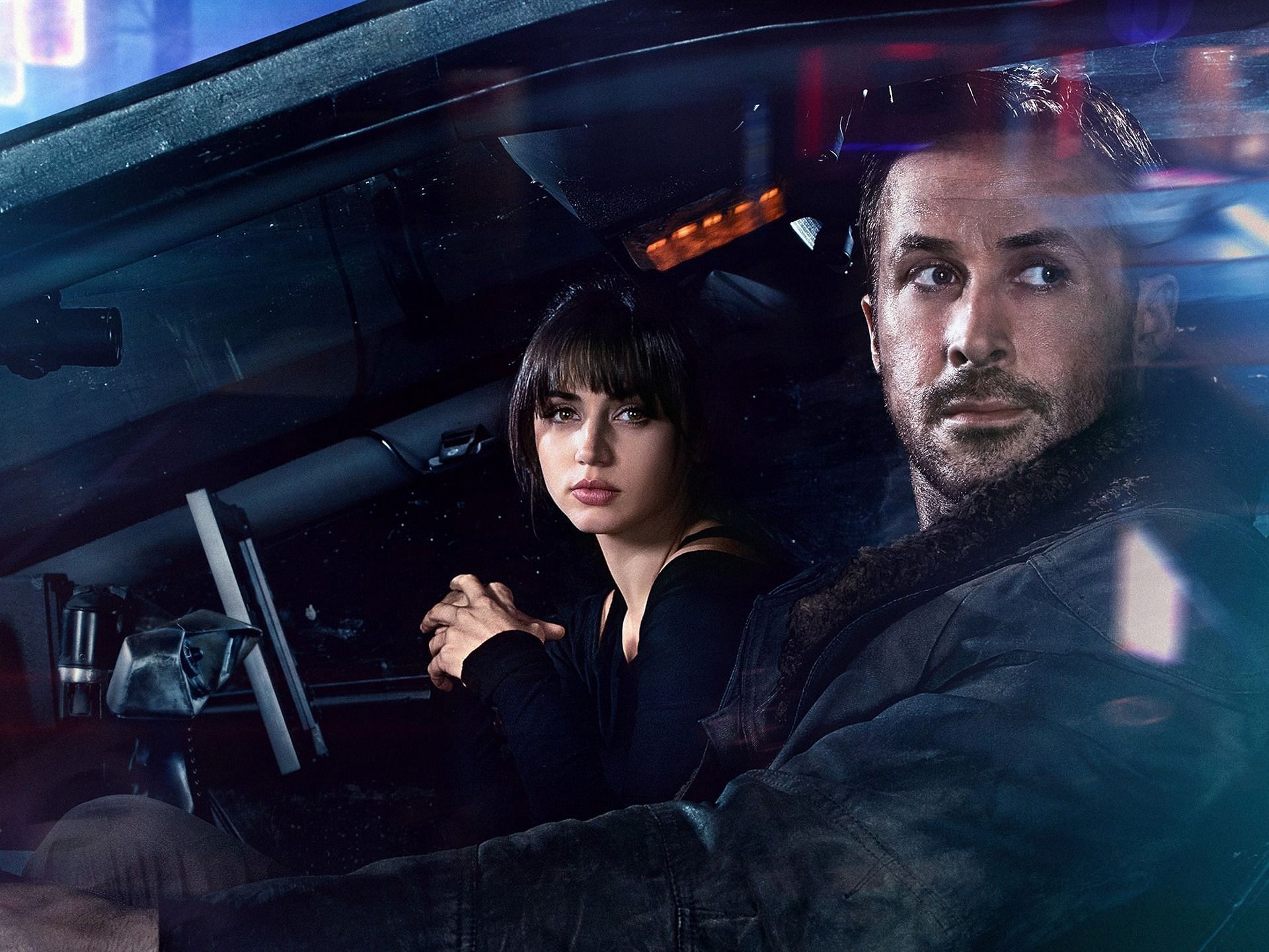 In Blade Runner 2049, Ana De Armas plays Joi, a holographic companion and love interest to Ryan Gosling&#039;s character, Officer K. (Image via Warner Bros. Pictures)