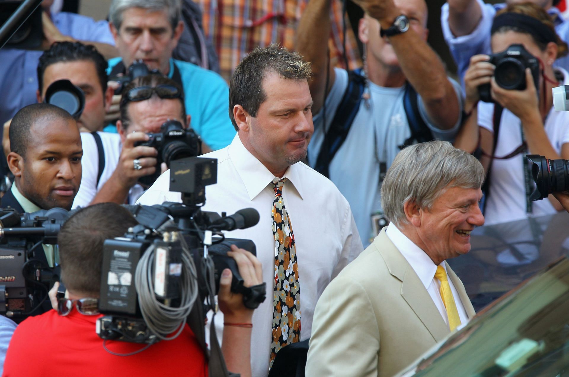 Baseball pitching star Roger Clemens walks out of the U.S. District Court after his arraignment, on August 30, 2010 in Washington, DC.