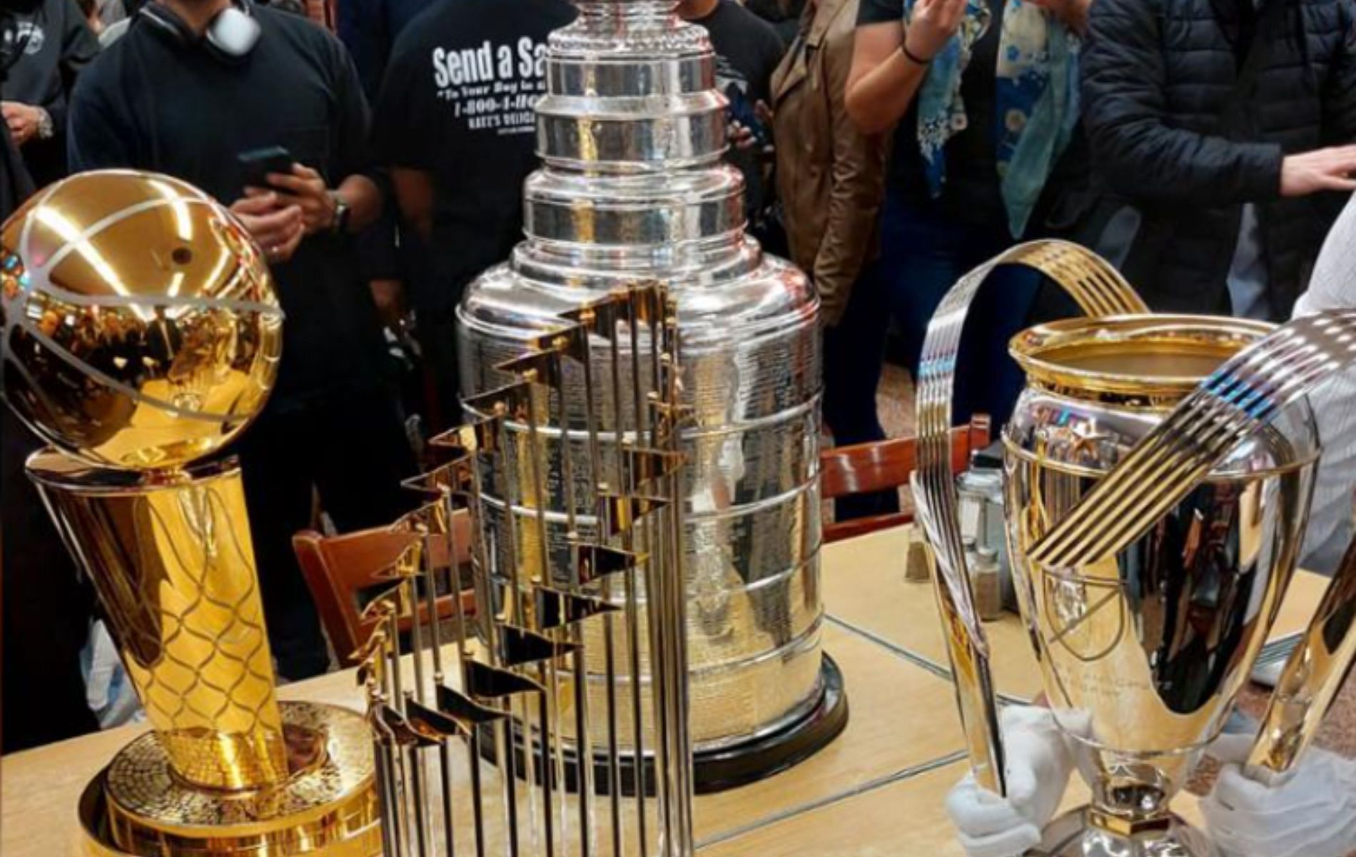 A boy looks at the Larry O'Brien Trophy that was on display during