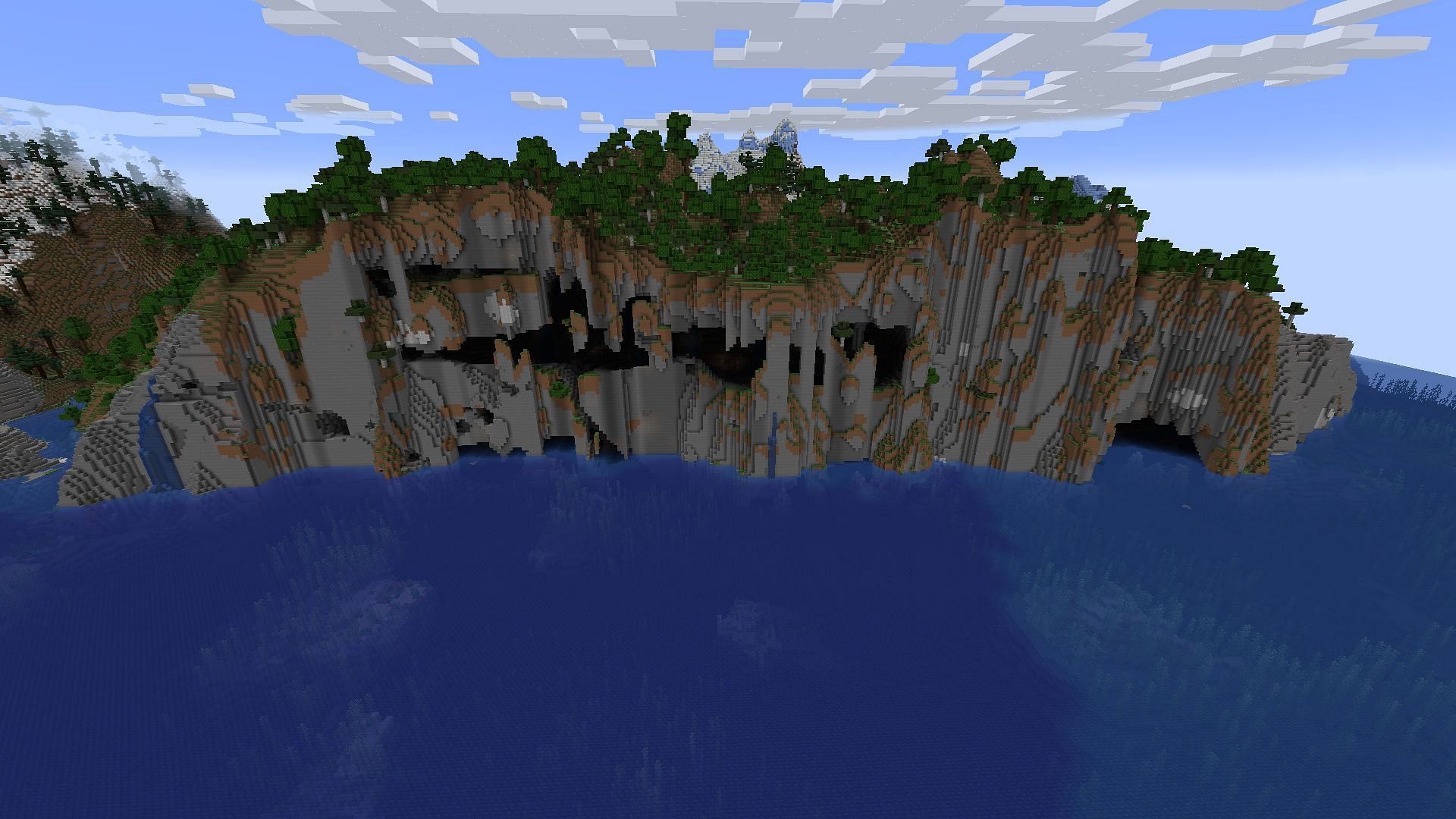 Minecraft spelunkers may find plenty of places to explore and battle on this seed&#039;s spawn landmass (Image via Mojang)
