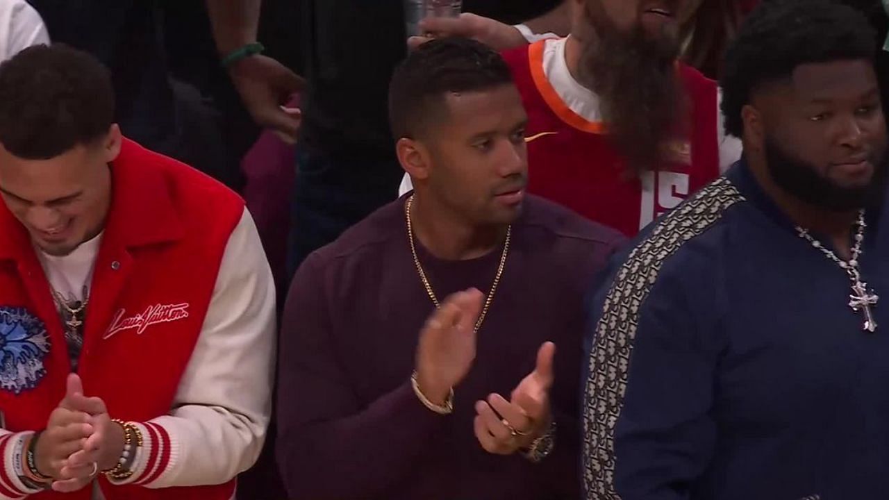Denver Broncos quarterback Russell Wilson sitting courtside at the Nuggets