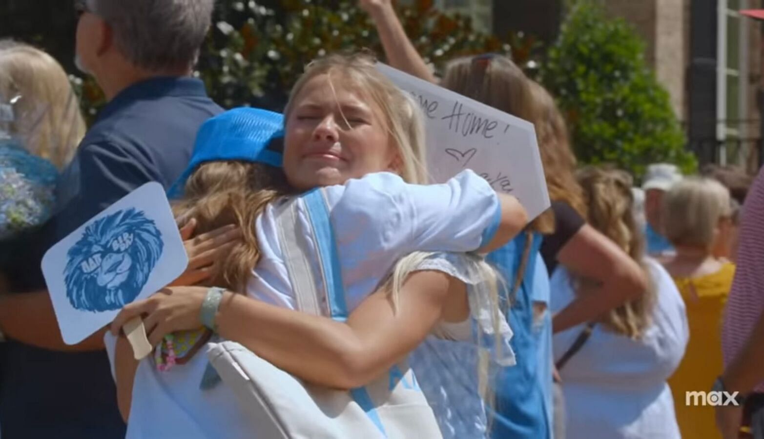 Two young women hug each other as they pass one of the challenges in the rush (Image via HBO)