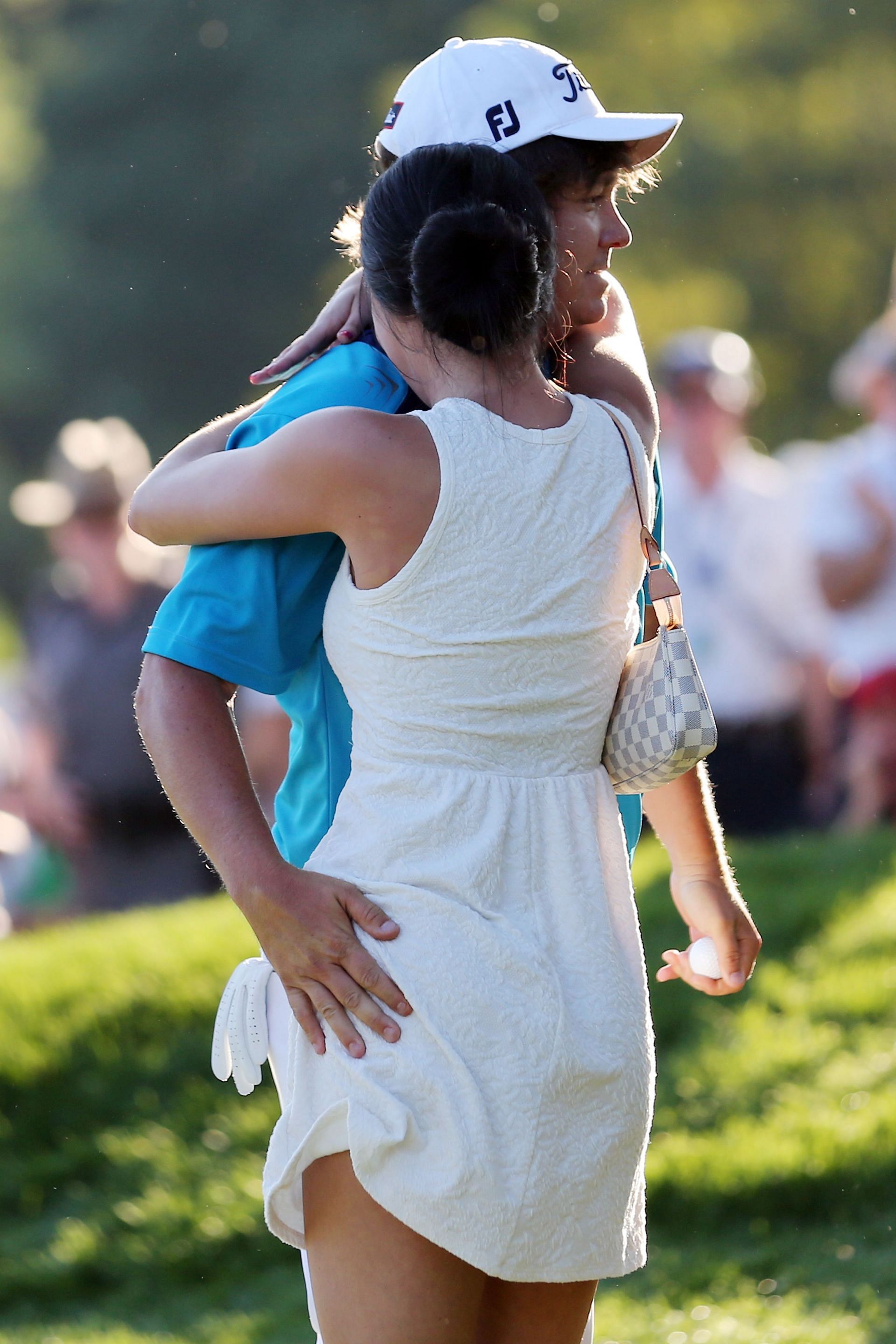Jason Dufner hugs his wife, Amanda Boyd, after winning the 2013 PGA Championship (via Getty Images)