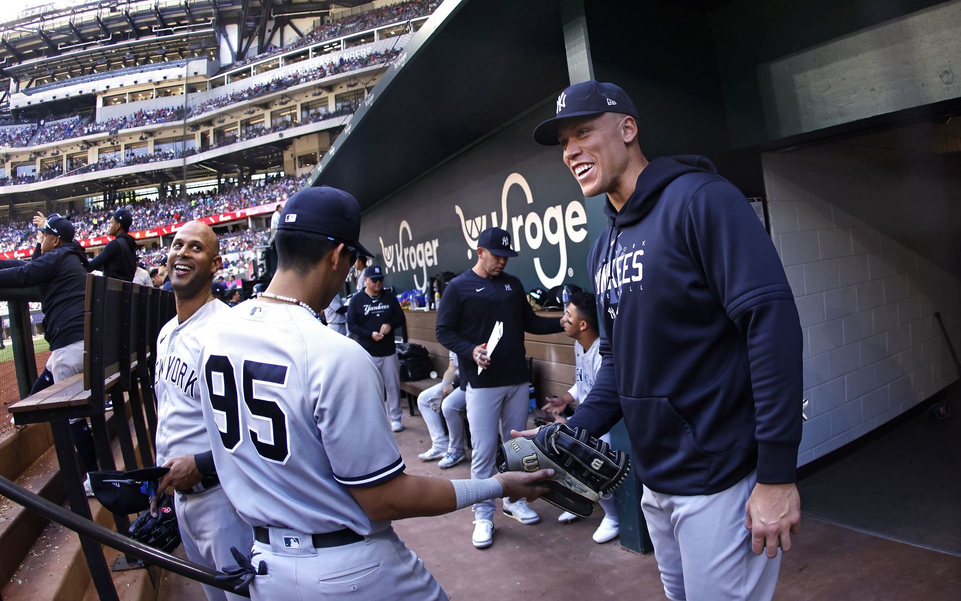 Aaron Judge #99 of the New York Yankees welcomes teammates to the dugout