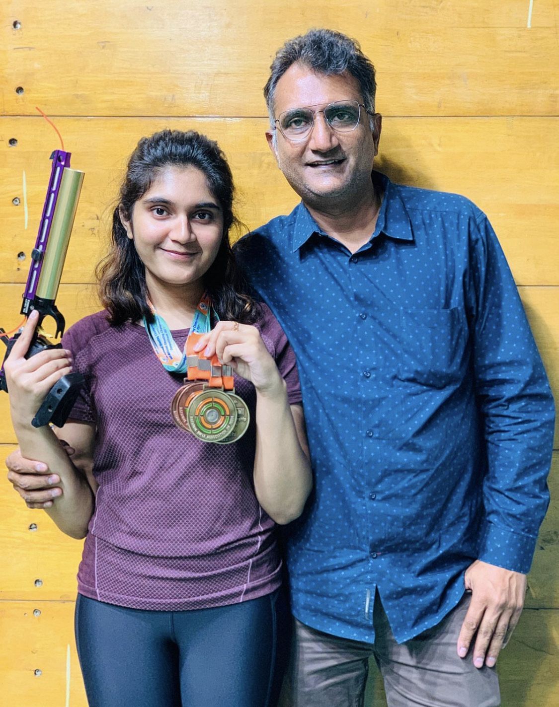 Esha Singh poses with her father after winning a tournament. (Picture Credits: Esha Singh)