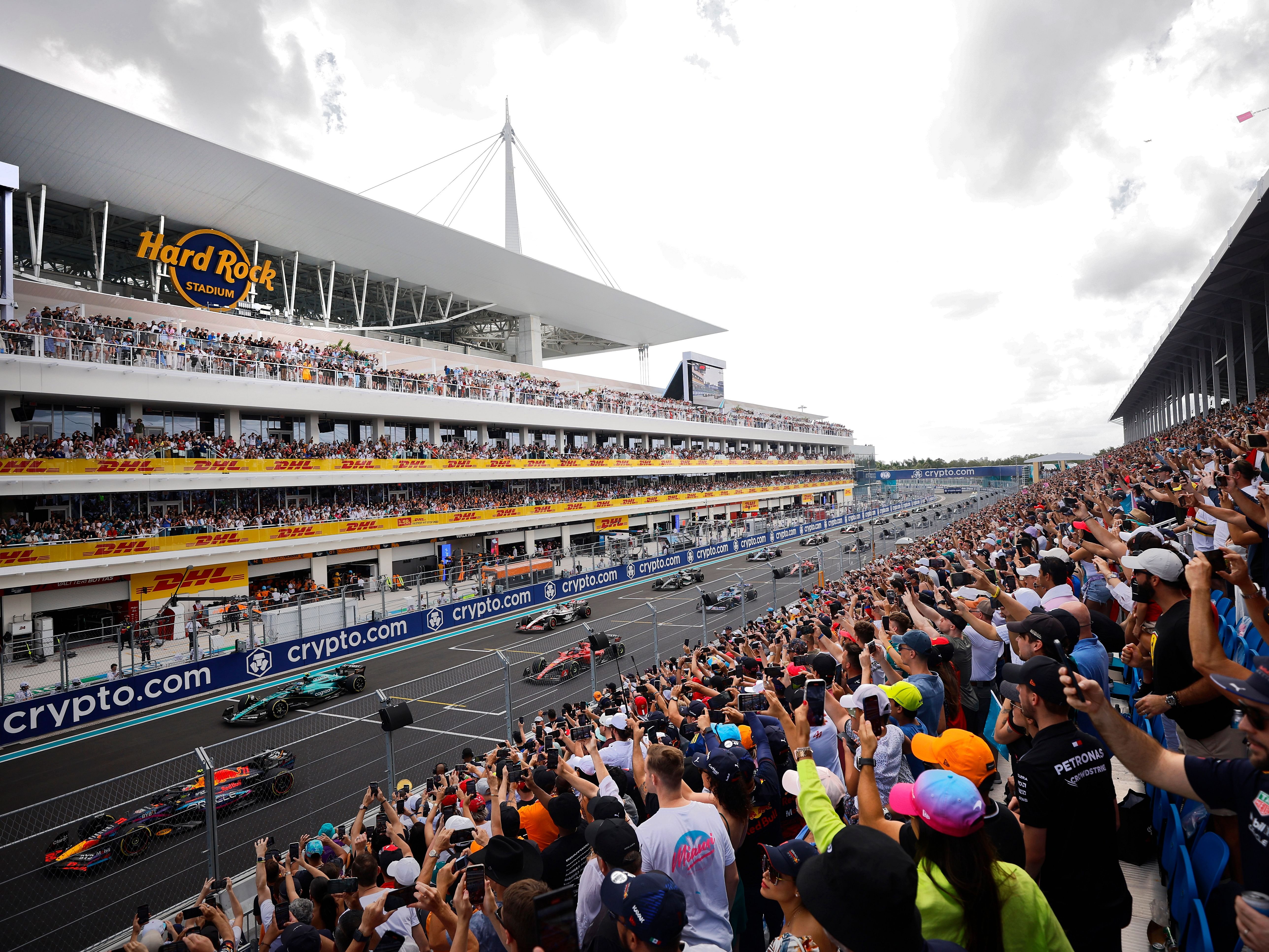 Sergio Perez (11) leads Fernando Alonso (14) and the rest of the field off the line at the start during the 2023 F1 Miami Grand Prix. (Photo by Jared C. Tilton/Getty Images)