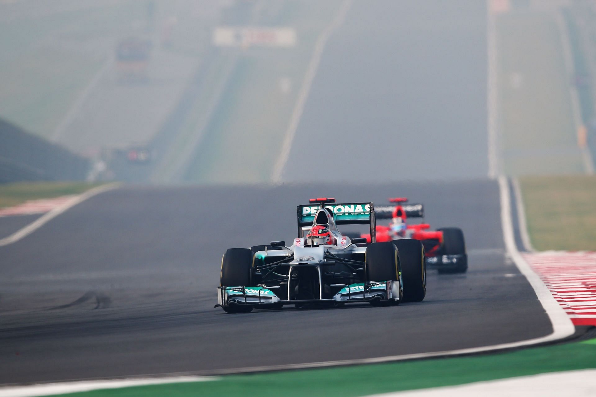 Michael Schumacher racing during the F1 Indian GP(Photo by Clive Mason/Getty Images)