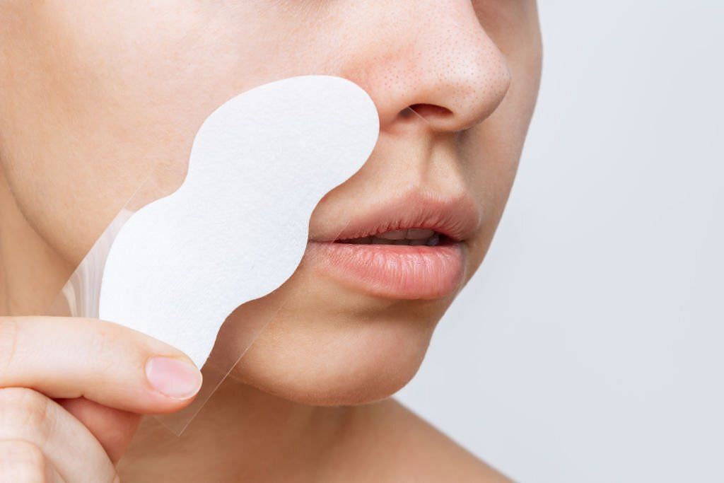 ow to use pore strips effectively to remove blackheads: A Step-by-Step Guide (Image via iStockPhoto)