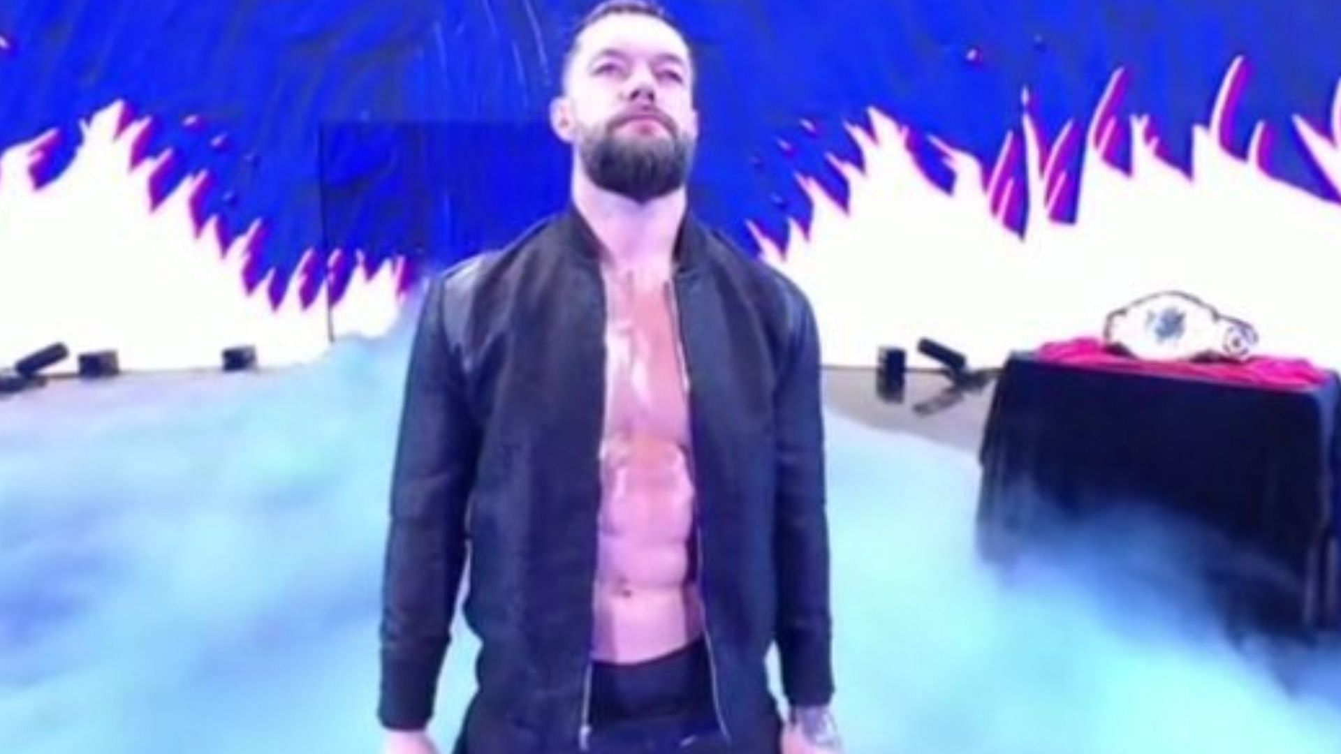 Finn Balor makes his entrance for the WWE RAW main event.