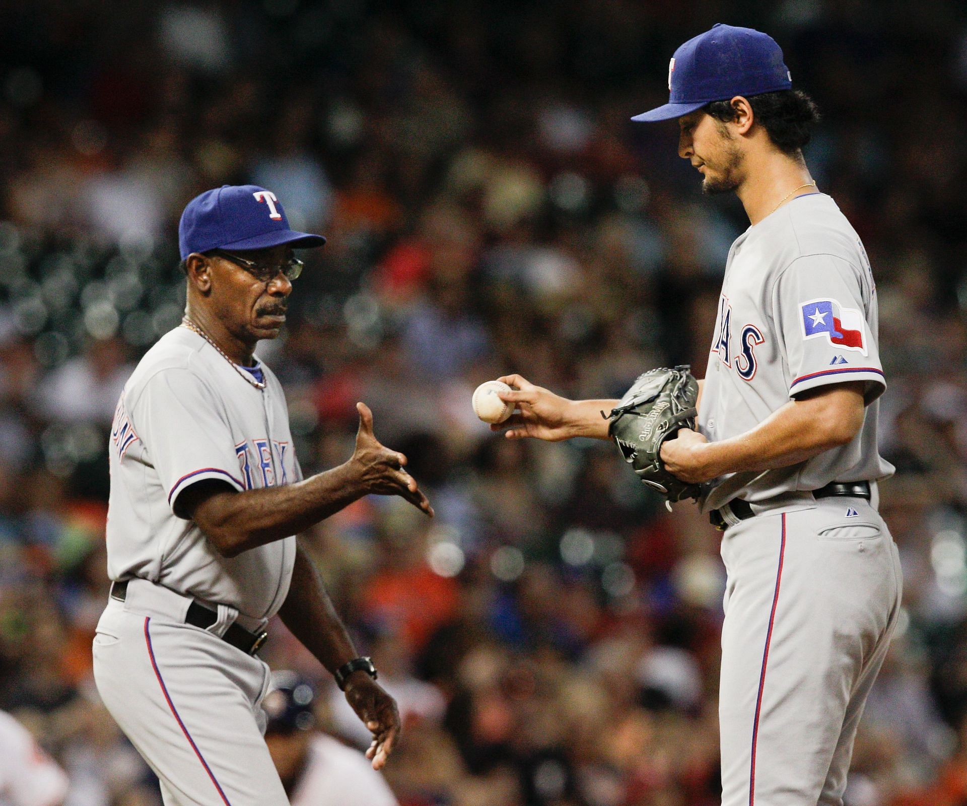 Texas Rangers v Houston Astros: HOUSTON, TX - AUGUST 09: Yu Darvish (11) of the Texas Rangers gives the ball to manager Ron Washington (38) as he leaves the game in the fifth inning against the Houston Astros at Minute Maid Park on August 9, 2014, in Houston, Texas. (Photo by Bob Levey/Getty Images)