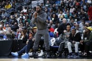 LeBron James of the Los Angeles Lakers reacts while watching his son Bronny play