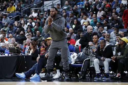 LeBron James of the Los Angeles Lakers reacts while watching his son Bronny play