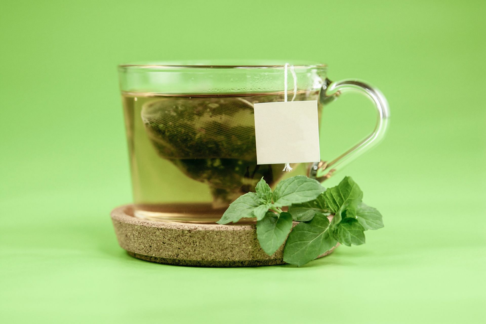 Drinking green tea before bed has potential health benefits. (Image via Unsplash/Laark Boshoff)