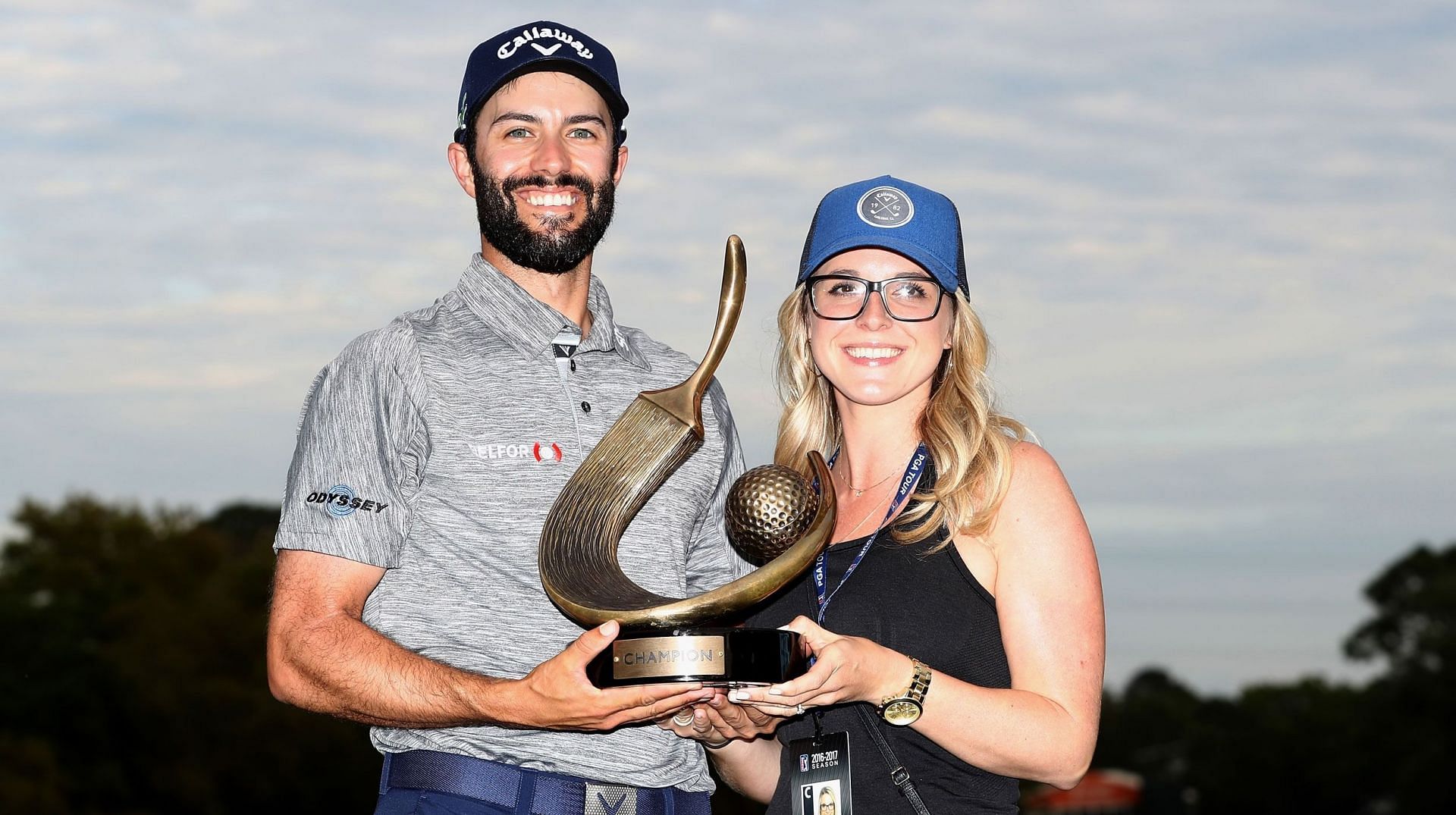 Adam Hadwin and his wife Jessica Hadwin pose with the 2017 Valspar Championship trophy