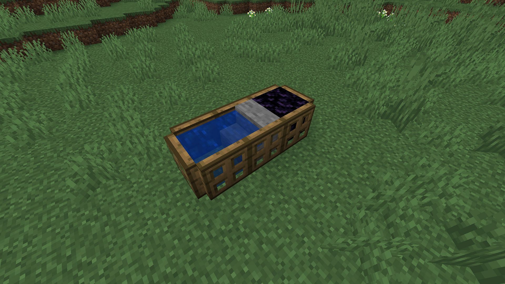 The completed obsidian generator with a full obsidian block where the lava is normally placed (Image via Mojang)