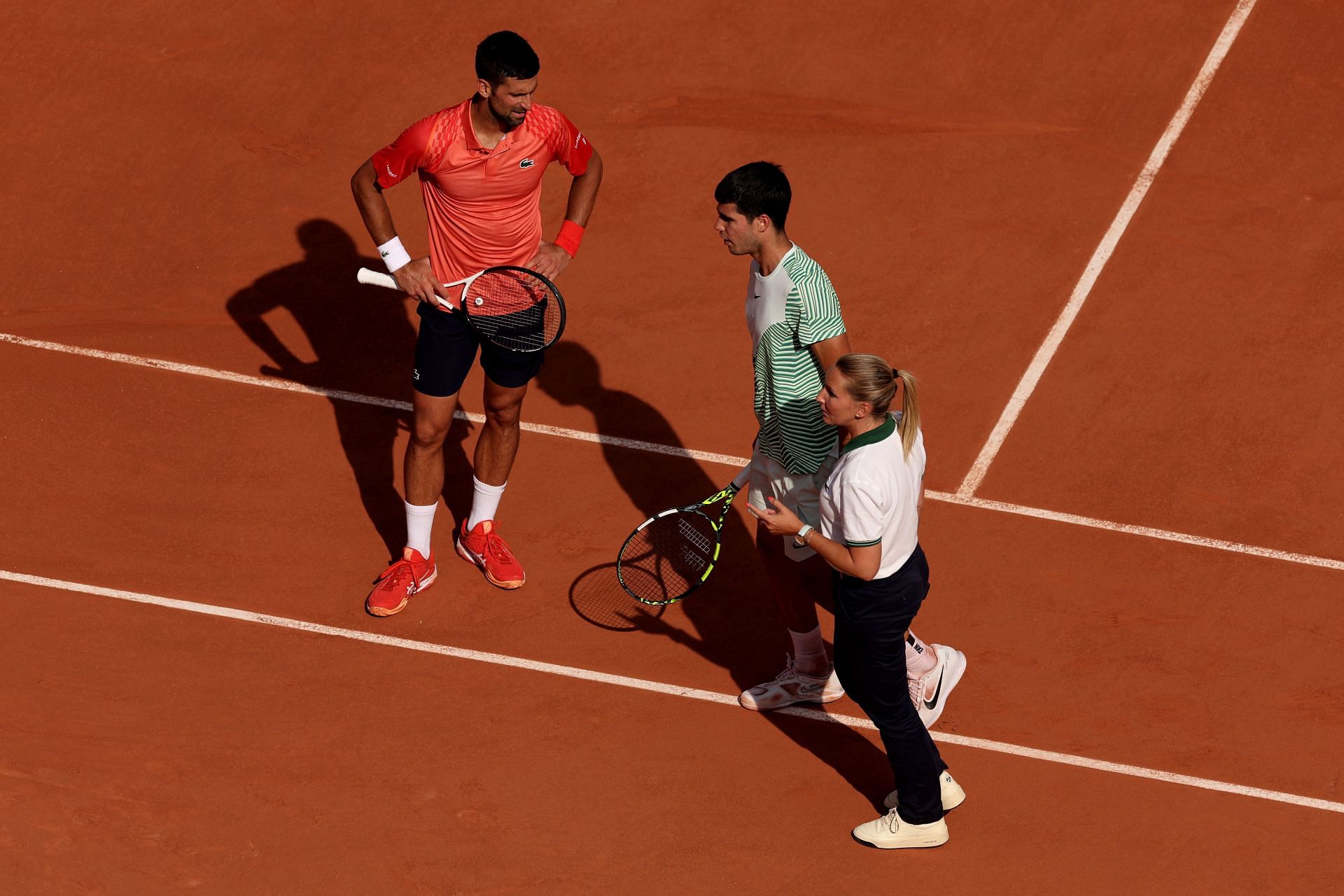 Novak Djokovic checked on Carlos Alcaraz during their 2023 French Open semifinal.