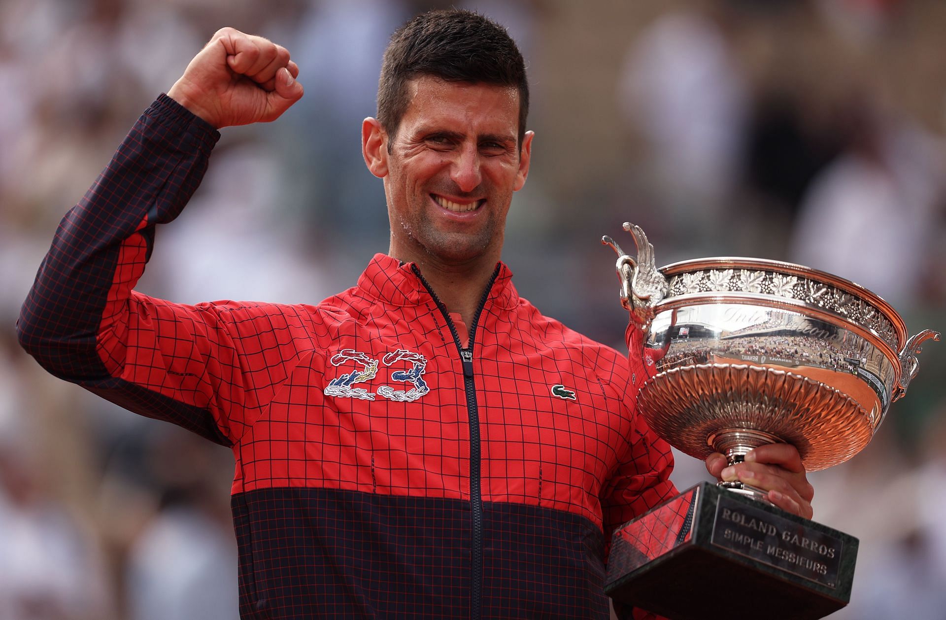 Novak Djokovic pictured at the 2023 French Open with the title