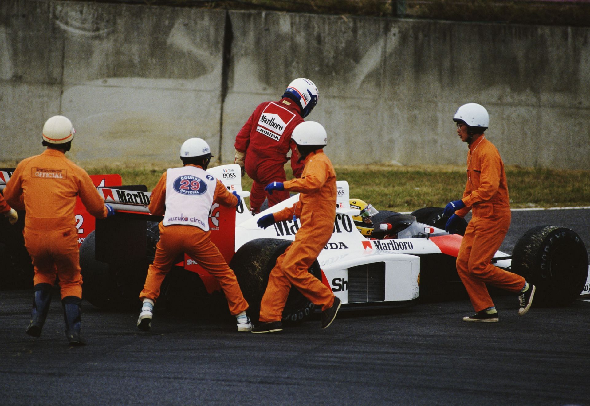 Prost getting out of his McLaren after colliding with Ayrton Senna (Photo by Pascal Rondeau/Getty Images)