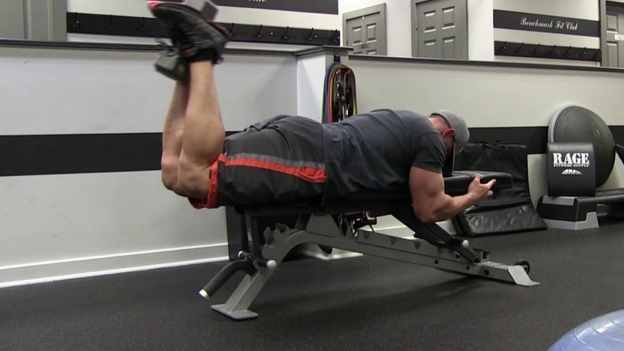 The lying dumbbell leg curl is a highly effective exercise for specifically targeting and strengthening the hamstrings. (Image via FITASTIC/ Youtube)