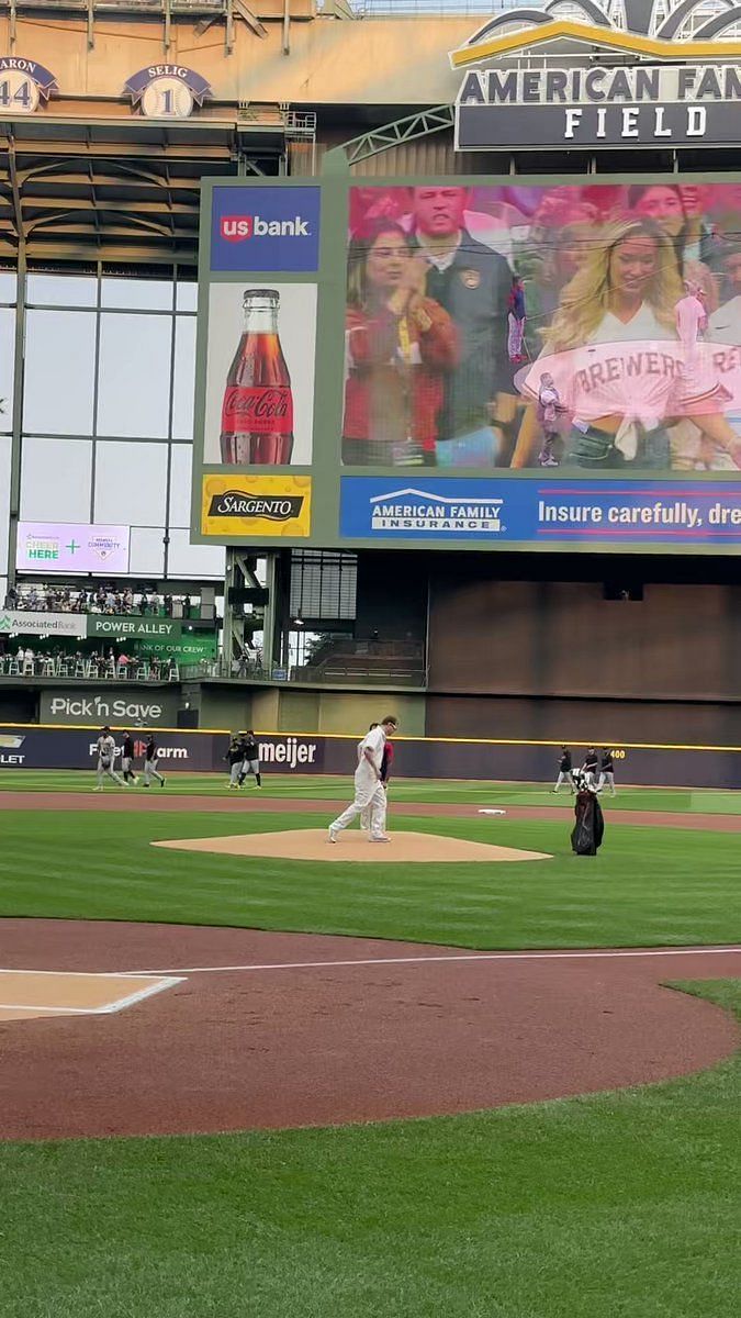 Paige Spiranac stuns baseball fans in unbuttoned shirt as she throws the  first pitch at the Milwaukee Brewers MLB game