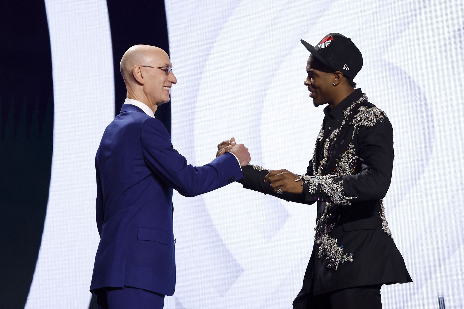 Scoot Henderson (R) poses with NBA commissioner Adam Silver (L) after being drafted third overall pick by the Portland Trail Blazers in the 2023 NBA draft
