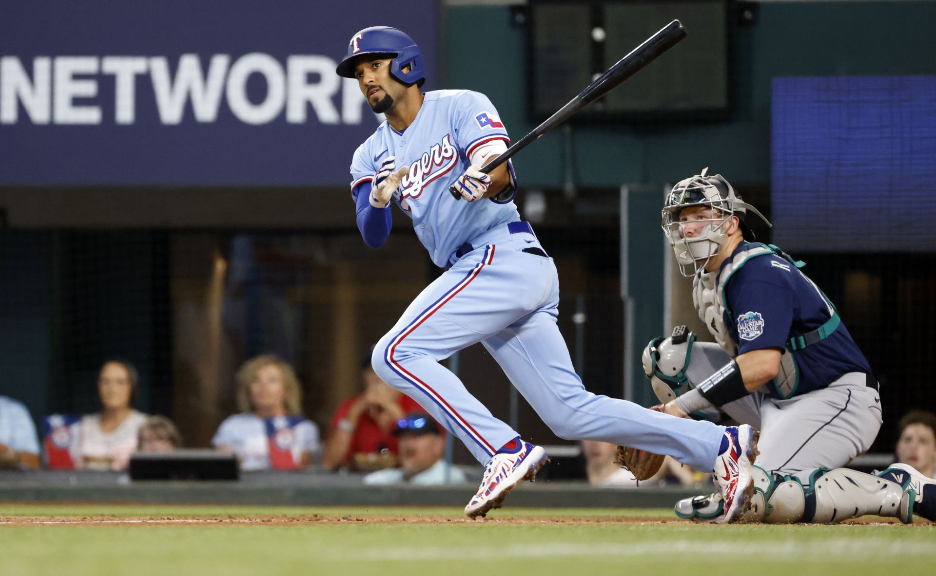 Marcus Semien of the Texas Rangers doubles against the Seattle Mariners at Globe Life Field