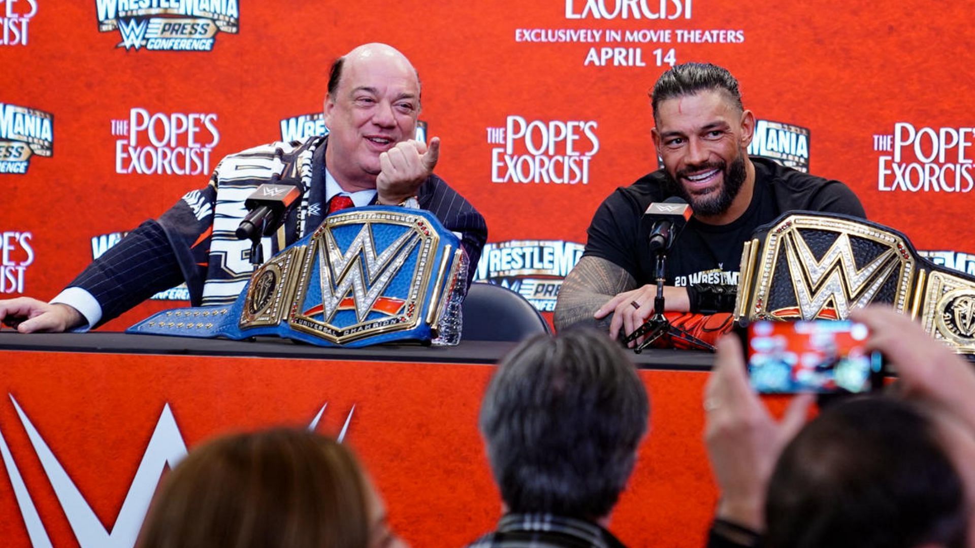 Paul Heyman and Roman Reigns at a press conference. Image Credits: wwe.com