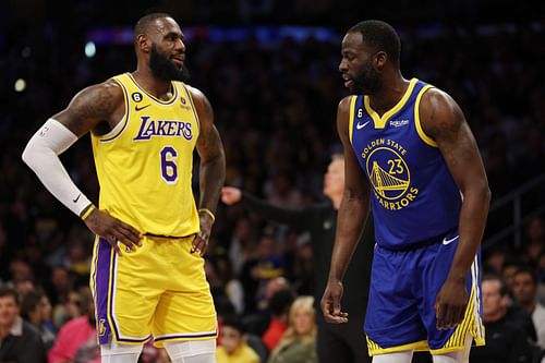 Draymond Green #23 of the Golden State Warriors speaks to LeBron James #6 of the Los Angeles Lakers during the first quarter in game six of the Western Conference Semifinal Playoffs