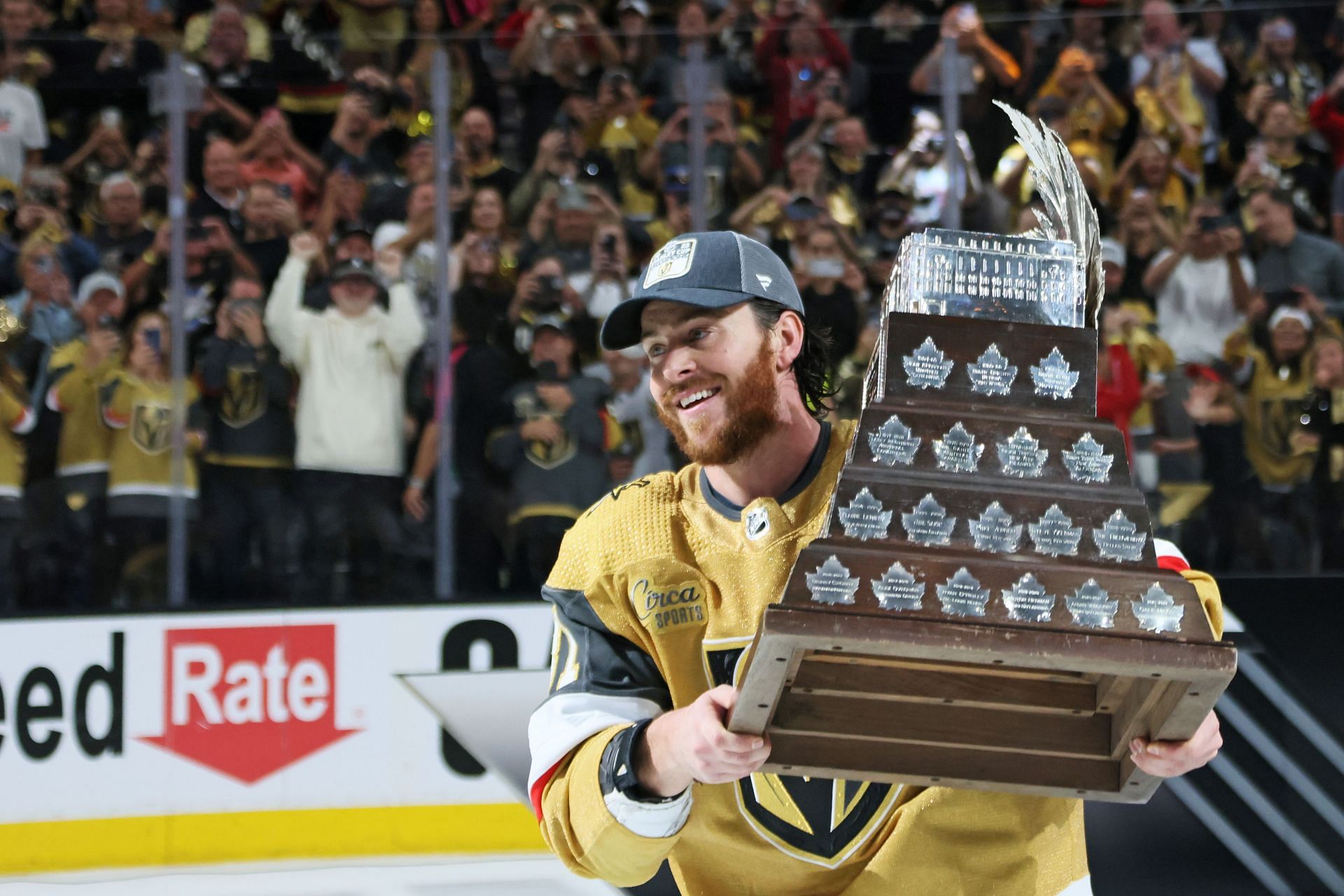 Jonathan Marchessault #81 of the Vegas Golden Knights hoists the Conn Smythe Trophy after a championship win against the Florida Panthers in Game Five of the 2023 NHL Stanley Cup Final at T-Mobile Arena on June 13, 2023 in Las Vegas, Nevada. (Photo by Bruce Bennett/Getty Images)