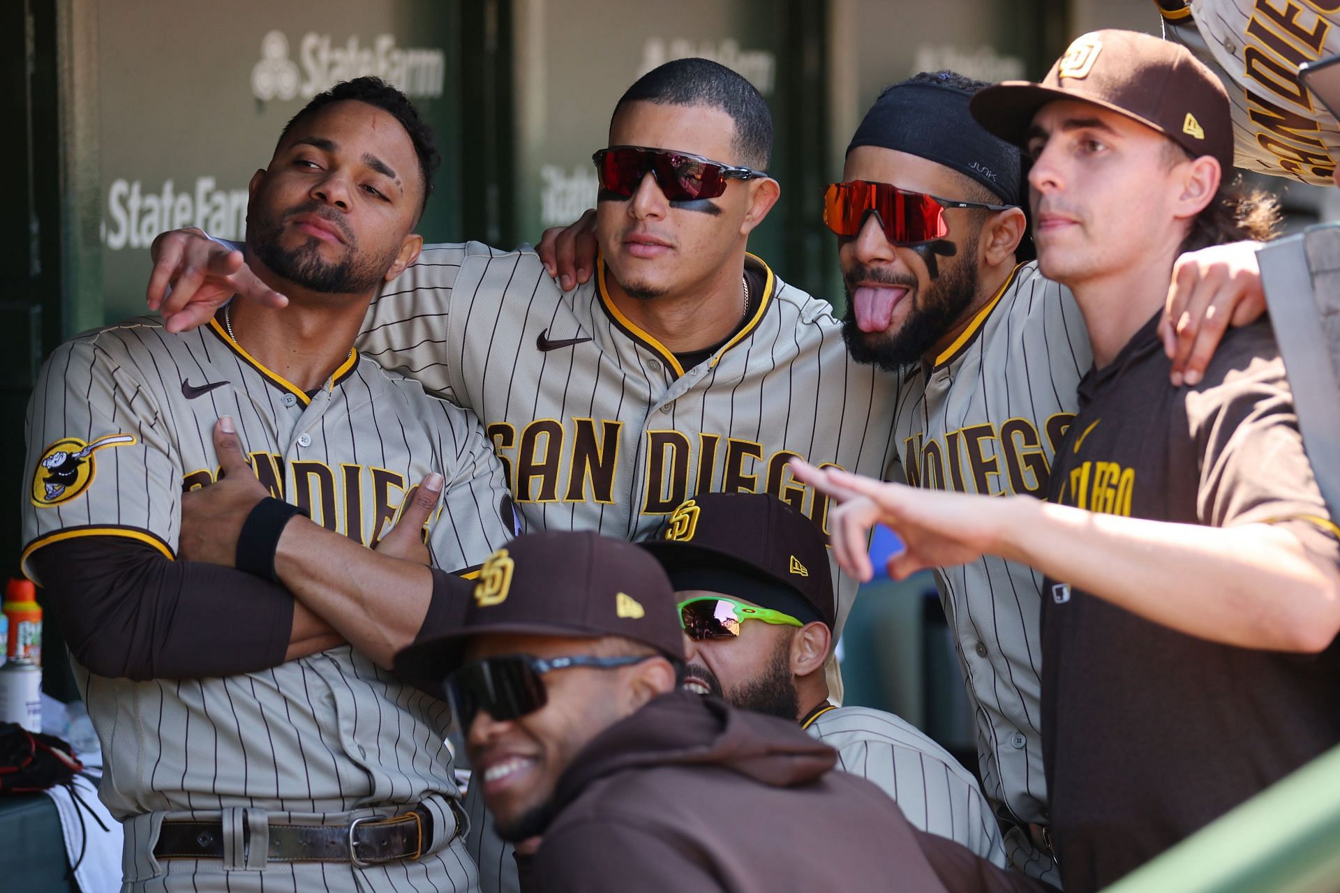 Xander Bogaert, Manny Machado and Fernando Tatis Jr. of the San Diego Padres pose for a photo at Wrigley Field