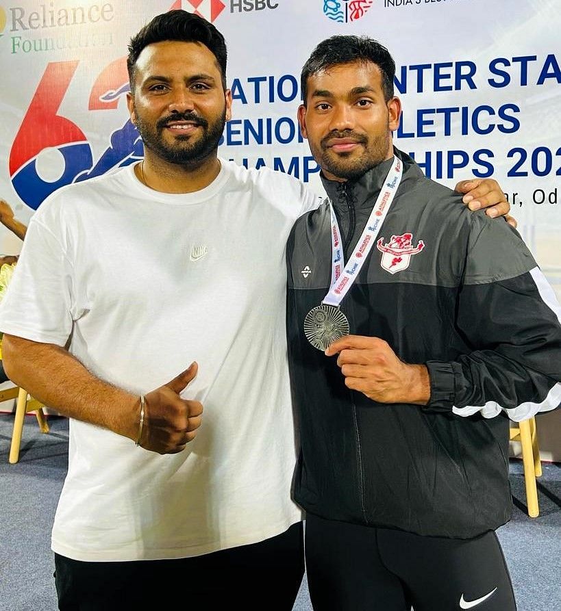 Kishore Kumar Jena (right) with the silver medal he won at the National Inter State Senior Athletics Championship in Bhubaneswar, Odisha. Photo credit: AFI 