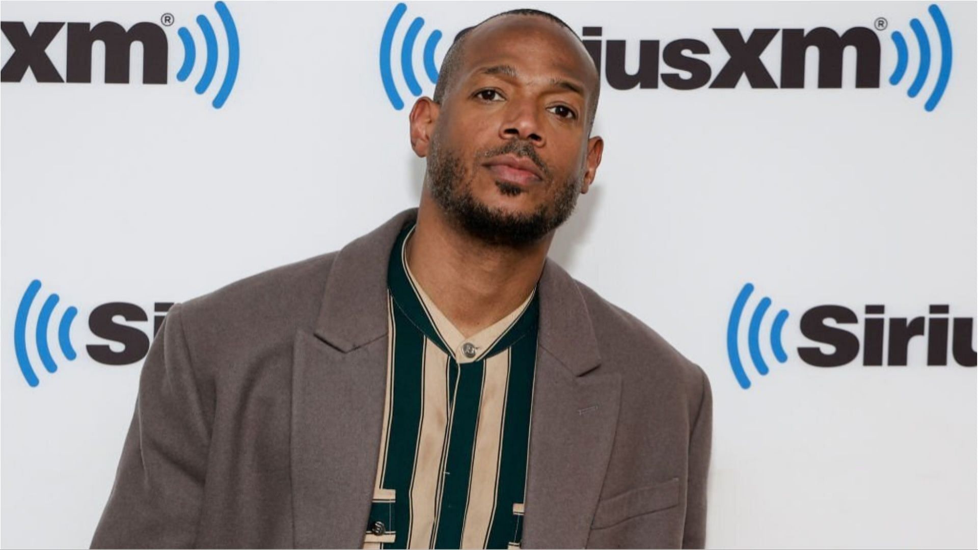 Marlon Wayans was removed from a United Airlines flight for getting involved in a dispute (Image via Jason Mendez/Getty Images)