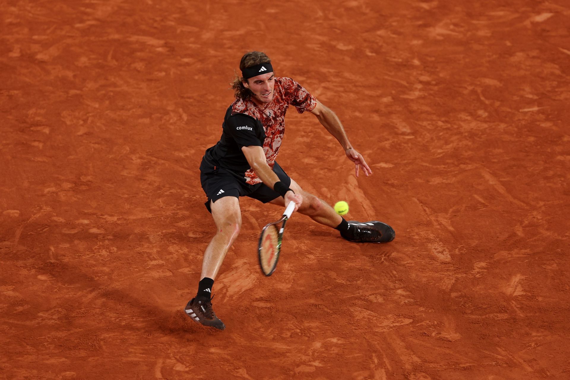 Stefanos Tsitsipas plaus a forehand at French Open