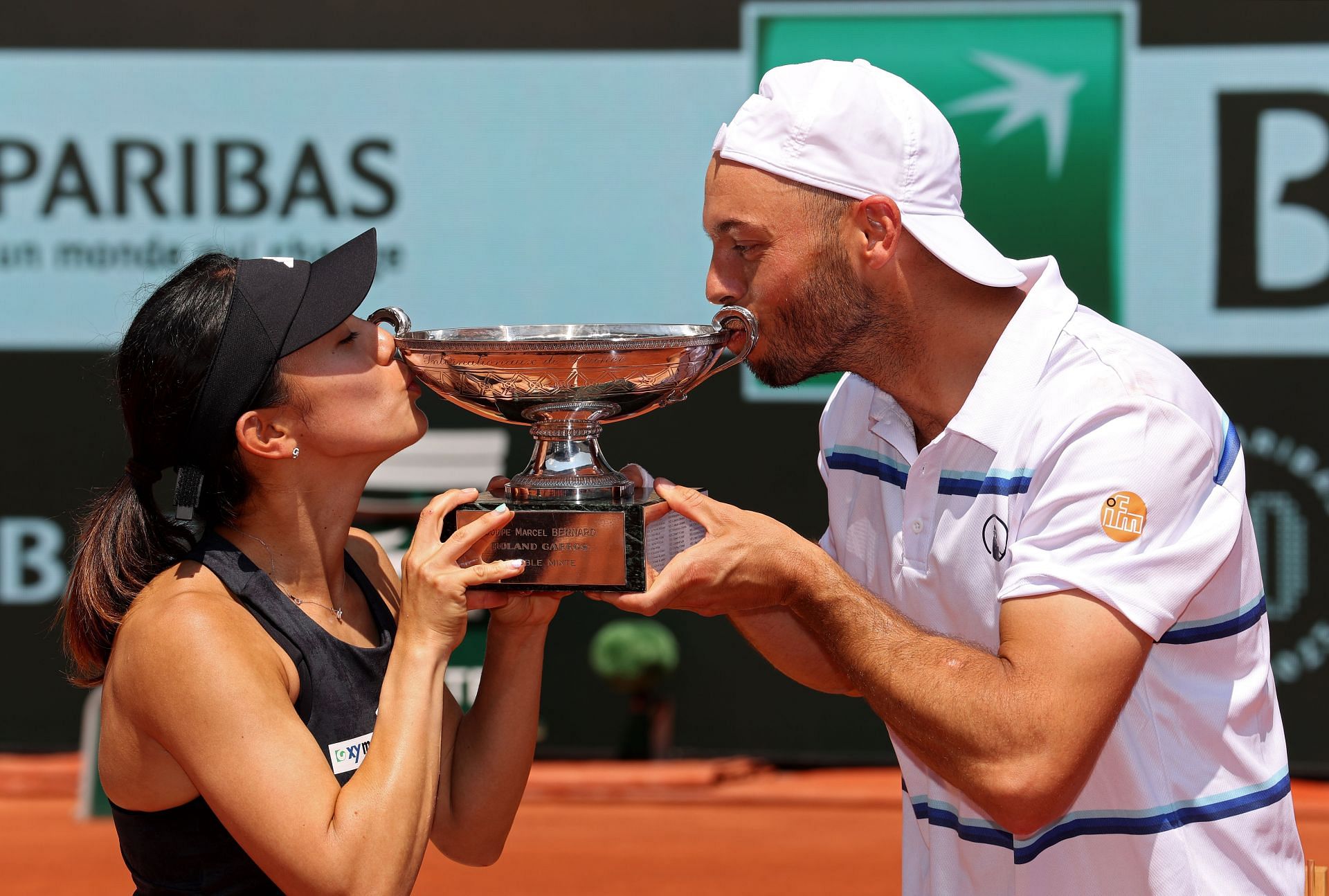 Miyu Kato and Tim Putz with the mixed doubles trophy at the French Open