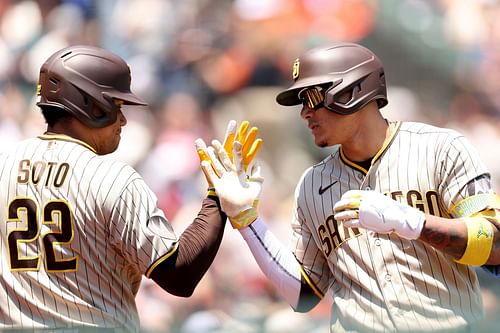 Manny Machado is congratulated by Juan Soto after a home run against the San Francisco Giants