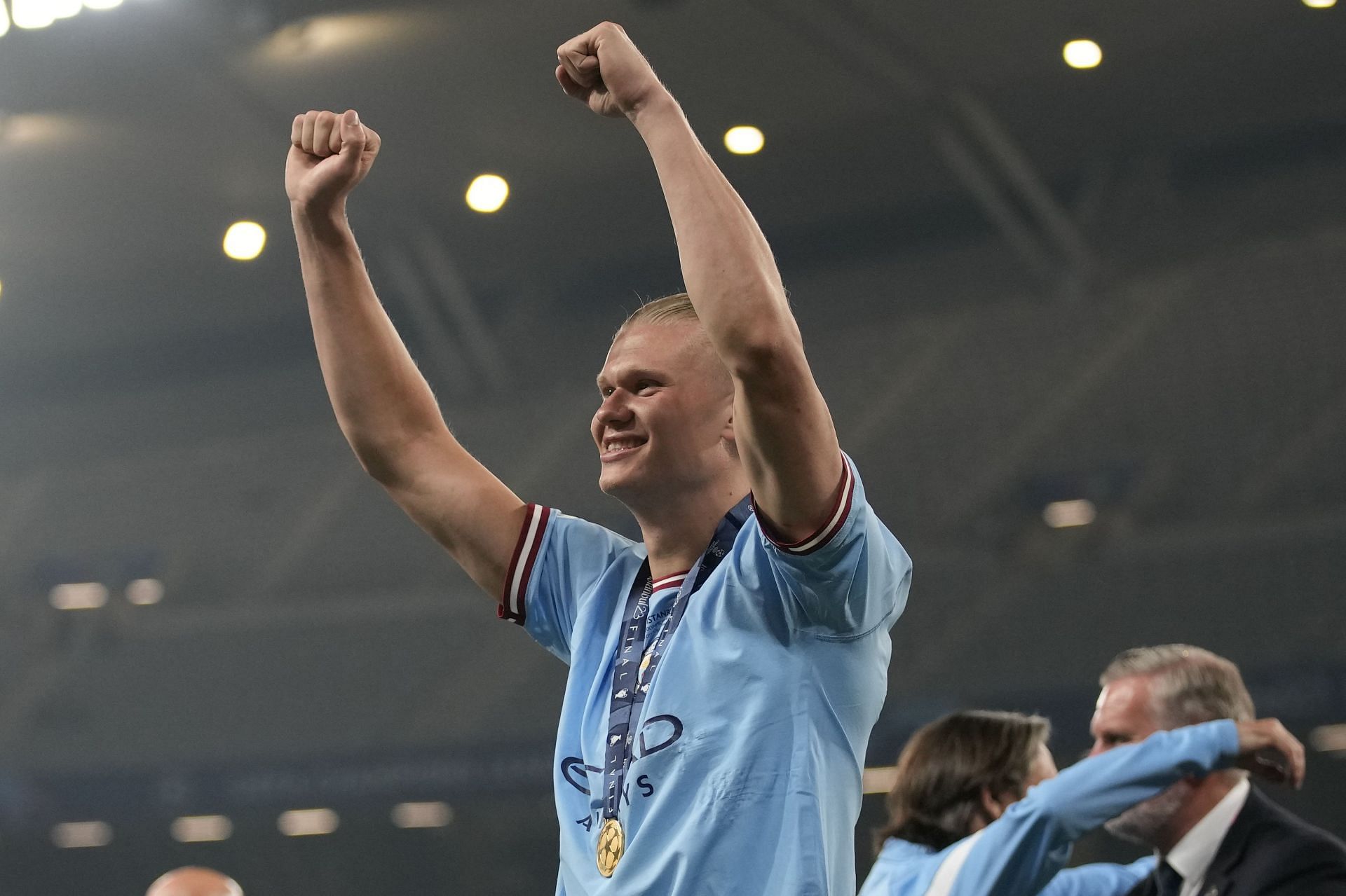 Erling Haaland celebrates after winning the Champions League