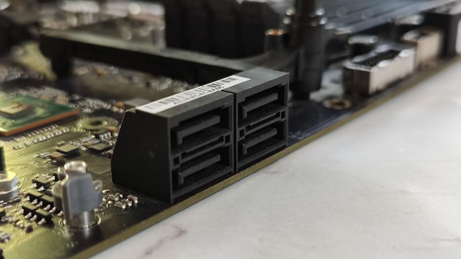 The SATA ports on the ROG Strix X670E motherboard (Image via Sportskeeda)