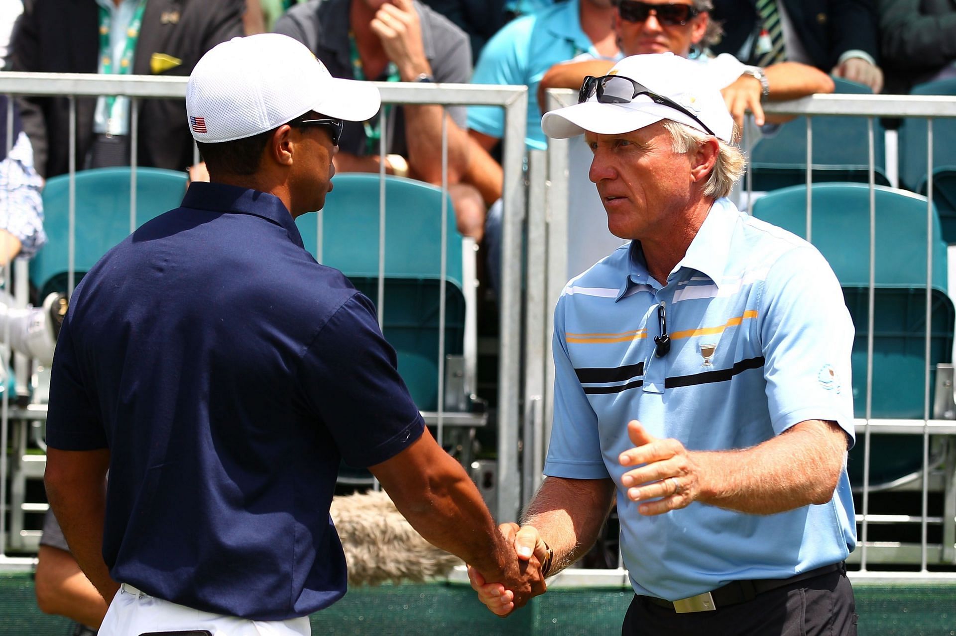 Tiger Woods and Greg Norman in 2011