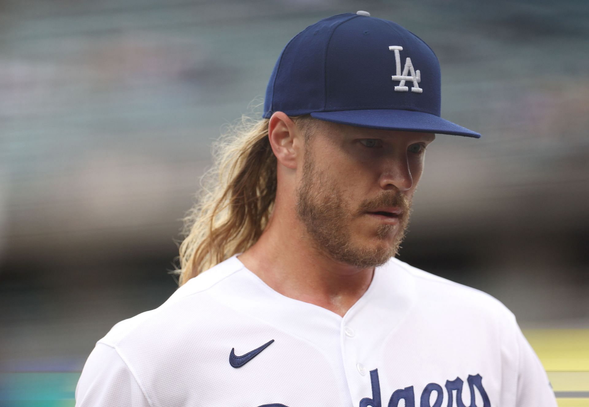 Noah Syndergaard of the Los Angeles Dodgers reacts as he comes to the dugout against the Washington Nationals at Dodger Stadium