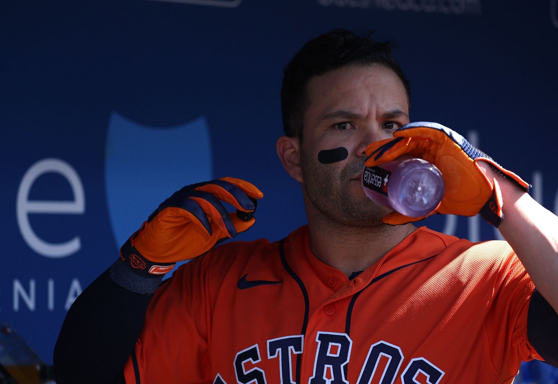 Jose Altuve #27 of the Houston Astros in the dugout before the game against the Los Angeles Dodgers at Dodger Stadium on June 24, 2023