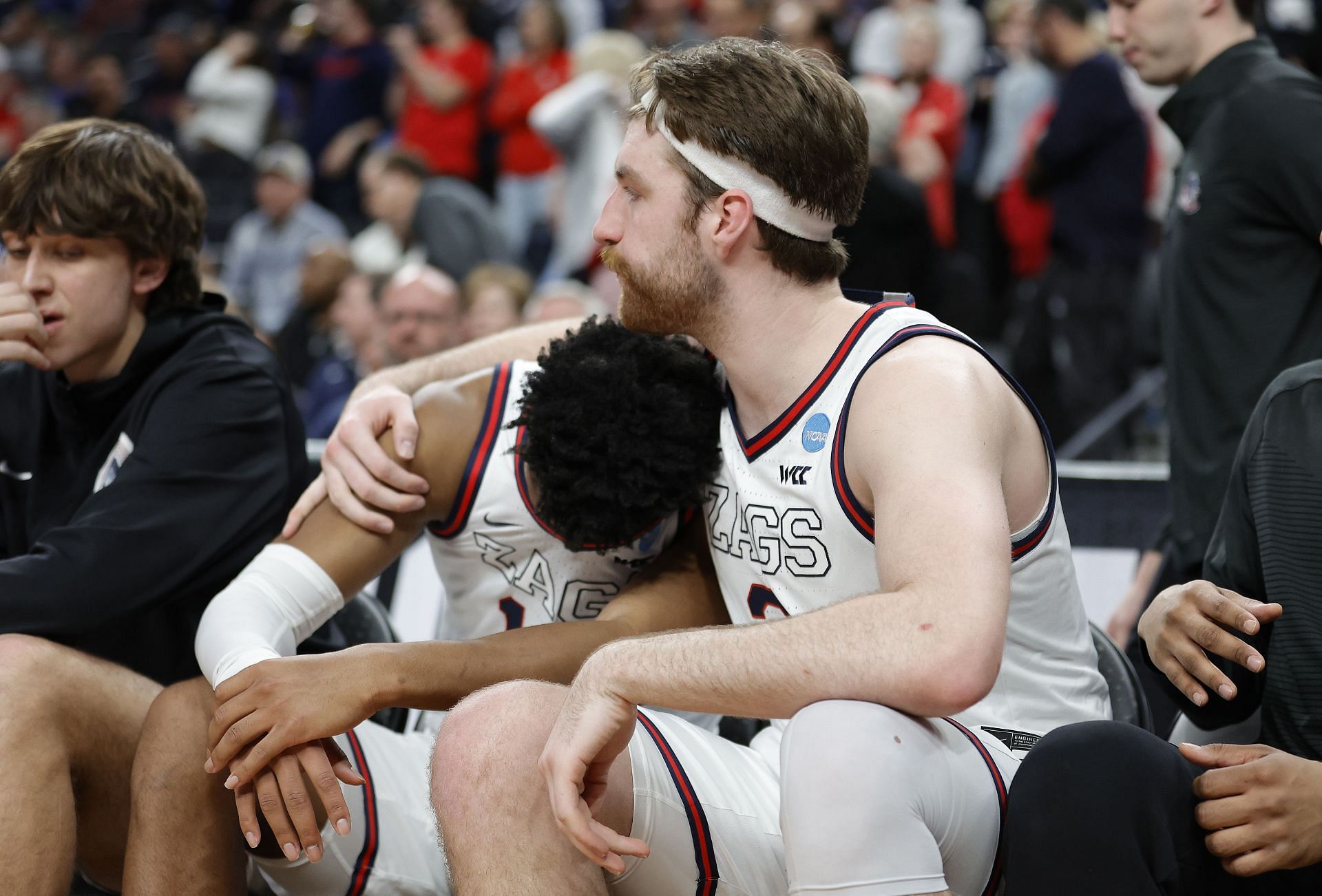 Drew Timme of the Gonzaga Bulldogs reacts with Malachi Smith #13 on the bench