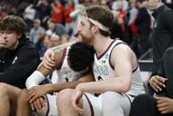 Drew Timme of the Gonzaga Bulldogs reacts with Malachi Smith #13 on the bench